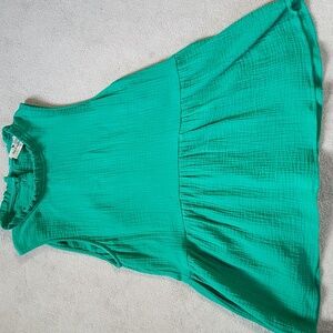 Sleeveless Green Ruffled Bottom Blouse with Brown Button up Back Design